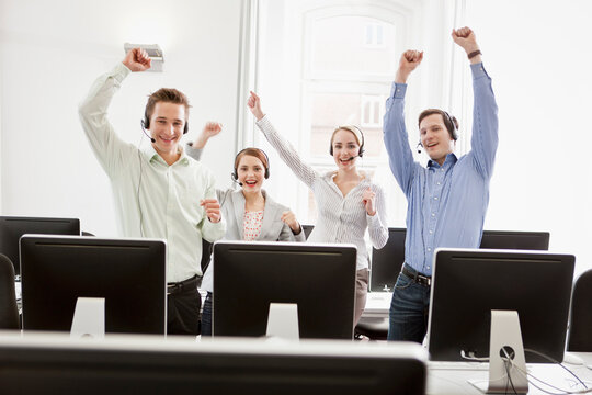Colleagues working in a call center with a very friendly atmosphere. Munich, Germany