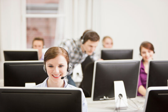Colleagues working in a call center with a very friendly atmosphere. Munich, Germany