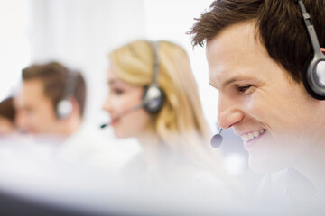 Colleagues working in a call center with a very friendly atmosphere. Munich, Germany