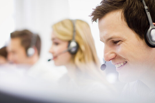 Colleagues working in a call center with a very friendly atmosphere. Munich, Germany