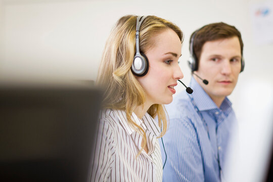 Colleagues working in a call center with a very friendly atmosphere. Munich, Germany
