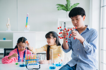 Portrait of Primary class children engaged in hands-on scientific experiments. Students discovering the wonders of science through interactive and engaging experiments.