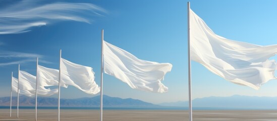 Mockup of white flags against a blue sky background. A mockup of a clean flash for applying the design. White flag flapping in the wind