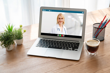 Doctor video call online by modish telemedicine software application for virtual meeting with patient - obrazy, fototapety, plakaty