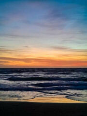 Amazing sunset over sea in Golden Bay Malta.