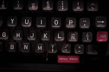 Keys of a typewriter on dark background. - obrazy, fototapety, plakaty
