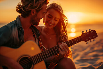 a young happy couple with guitar sitting on a exotic sunset beach - obrazy, fototapety, plakaty