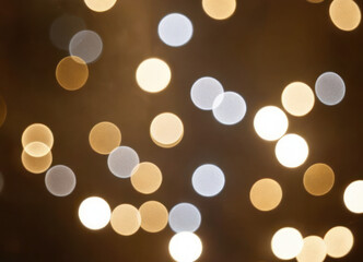 Luxury Blurred abstract background with gold and silver bokeh.