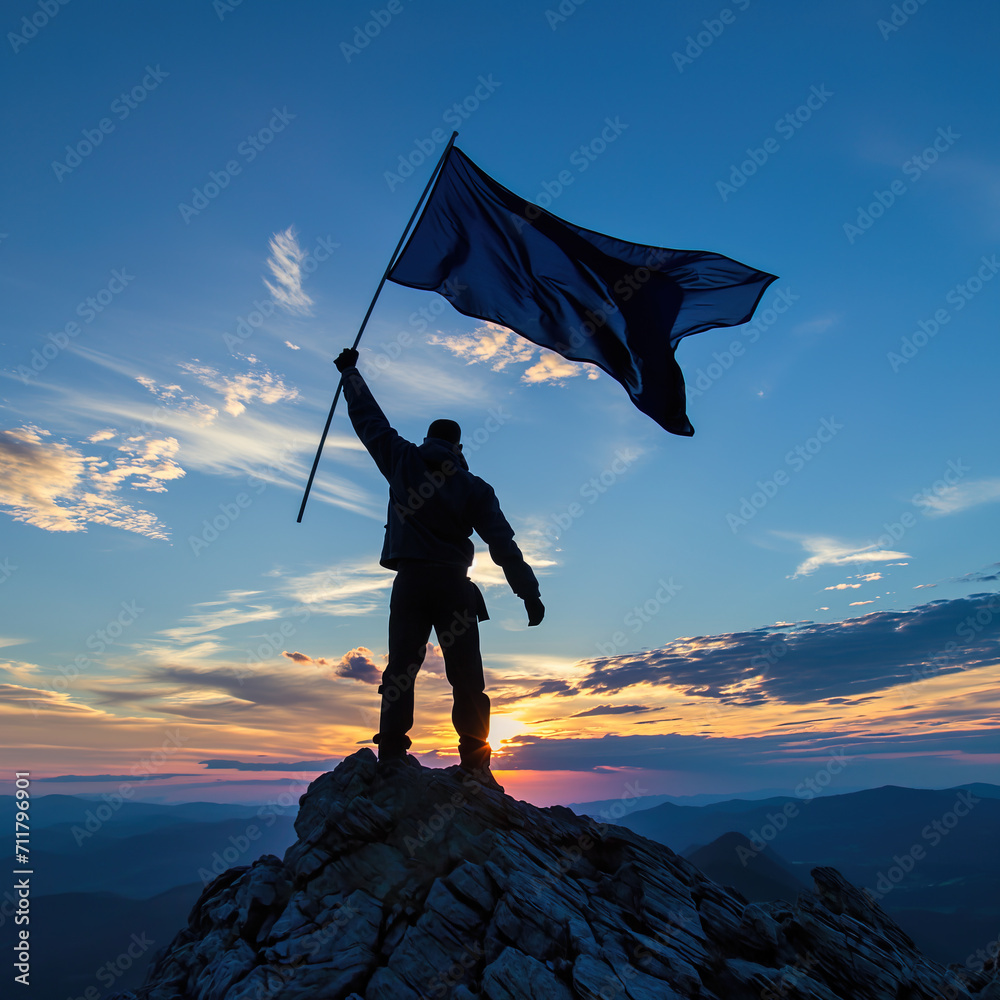 Wall mural Silhouette of man waving flag on mountain top , celebrating success and achievement - Wall murals