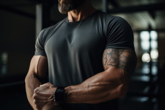 Close-up of a muscular man with tattoos adjusting his smartwatch. - Powered by Adobe