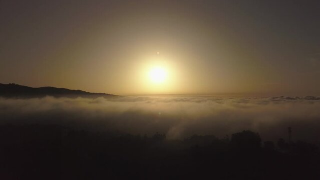Flying over the majestic sea of clouds in the Canary Islands, clouds and ravines in Gran Canaria, magical sunset recorded with drone in 4k