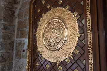 Arabic calligraphy depicting the Prophet Muhammad's name written on the door of the Mahmoudiya Mosque in Jaffa city, Israel