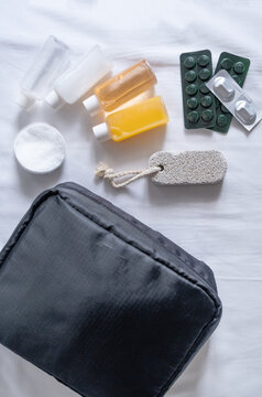 Travel cosmetics kit on bed , top view