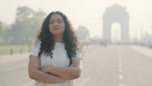 Confident Indian Girl with Curly Hair at India Gate