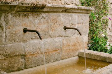 water feature on old wall in corsica