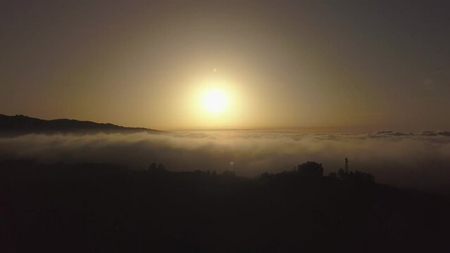 Flying over the majestic sea of clouds in the Canary Islands, clouds and ravines in Gran Canaria, magical sunset recorded with drone in 4k