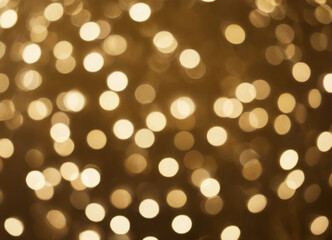 Golden abstract background with shiny golden floating bokeh.