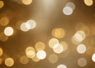 Golden abstract background with shiny golden floating bokeh.