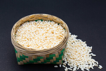 Puffed rice in a bamboo basket Side view 