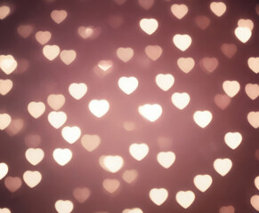Pink blurred abstract background with cute bokeh hearts.