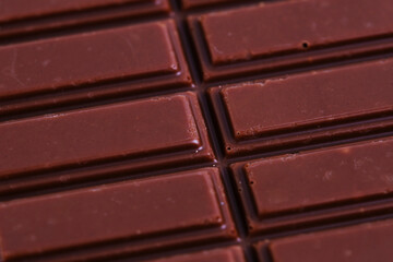 Bar of delicious milk chocolate closeup.