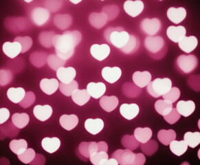 Pink blurred abstract background with cute bokeh hearts for mothers day.