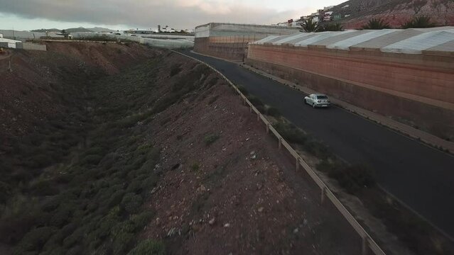 Driving in the Sunset, Exploring the Routes and Cruises of Gran Canaria, car tracking with drone in 4k, Canary Islands