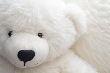 Close-up of a large plush teddy bear a cherished children's toy in pristine white its intricate stitching and cuddly texture showcased in exquisite detail with a high-definition camera