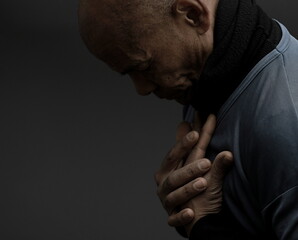 man praying to god Caribbean man praying with black grey background with people stock photo	