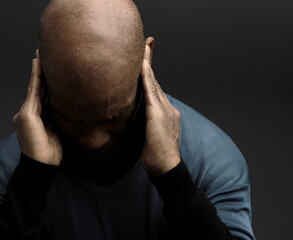 deafness suffering from hearing loss on grey black background with people stock image stock photo	