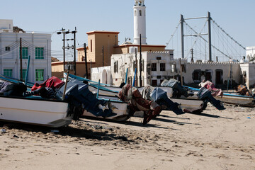 Small fishing boats on the shore of the Sur lagoon with the Sur, Oman -  February 3, 2016 - Small...