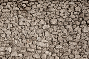 Background of stone wall texture photo. Close-up of stone wall.