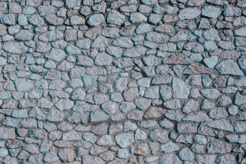 Background of stone wall texture photo. Close-up of stone wall.