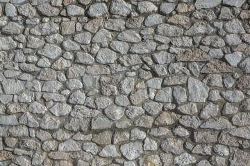 Background of stone wall texture photo. Close-up of stone wall.