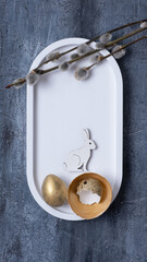 Easter composition with flowers, white rabbit and eggs flat lay, top view. Copy space.