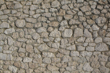 Background of stone wall texture photo. Close-up of stone wall.