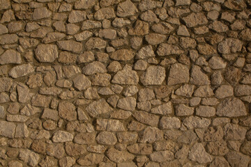 Background of stone wall texture photo. Close-up of stone wall.