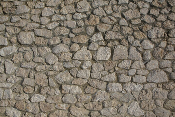 Background of stone wall texture photo. Close-up of stone wall.