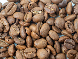 Close-up of roasted coffee beans. Can be used as a food background. Macro, top view, flat lay