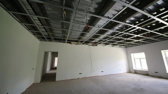Indoor view of room with suspended ceiling in building