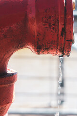 drop falling from a hydrant
