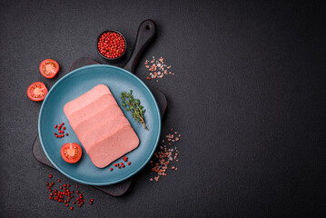 Delicious canned pink ham with salt, spices and herbs - obrazy, fototapety, plakaty