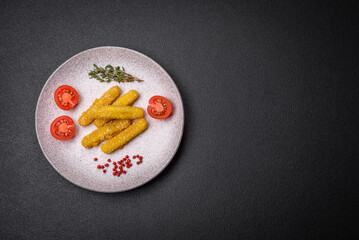 Delicious crispy cheese sticks with mozzarella, salt and spices, breaded and fried in oil