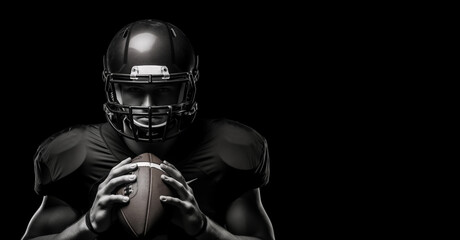 Black and white photography of an American football player holding rugby ball on a black background with copy space design