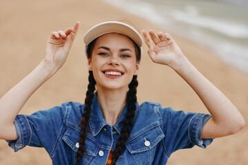Happy Young Woman Enjoying Summer Vacation in the City: Portrait of Attractive Female with Red Hat and Camera, Embracing Fun and Joy in Urban Street.