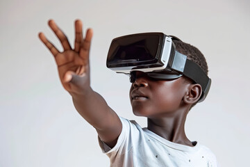 A young boy wearing a virtual reality headset reaches out his hand