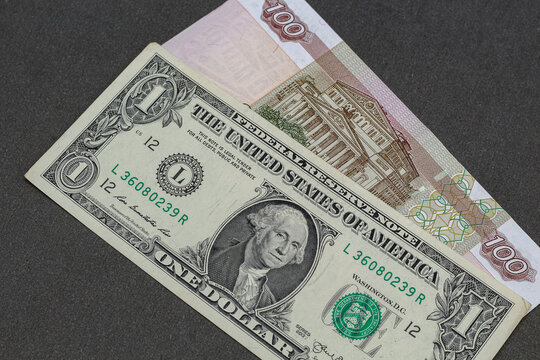 Closeup view of russian rubles and US dollars banknotes.