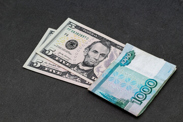 Closeup view of russian rubles and US dollars banknotes.