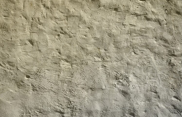 Close up shot of grunge brown clay wall on a old house. The mixture of some other object such as...