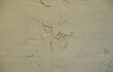 The texture of the wall, covered with gray foam polystyrene plates, which are smeared with a reinforcing mixture. Stage of wall insulation